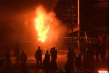 Cairo protests A police van burns on 6th October Bridge
